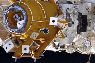 Survey views of the Mir space station taken by the crew of the STS-86 orbiter Atlantis including the Docking Module with target visible and Kristall.